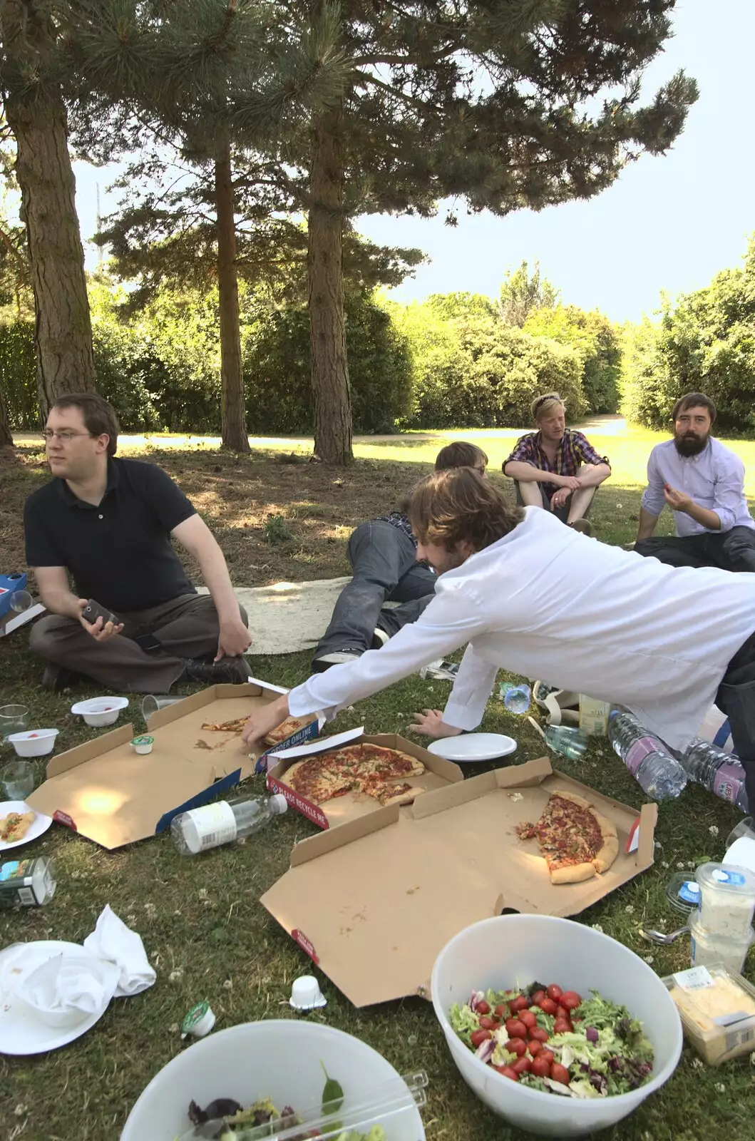 Chris grabs more pizza, from A Taptu Science Park Picnic, and Wedding Guests Arrive, Cambridge and Brome, Suffolk - 1st July 2010