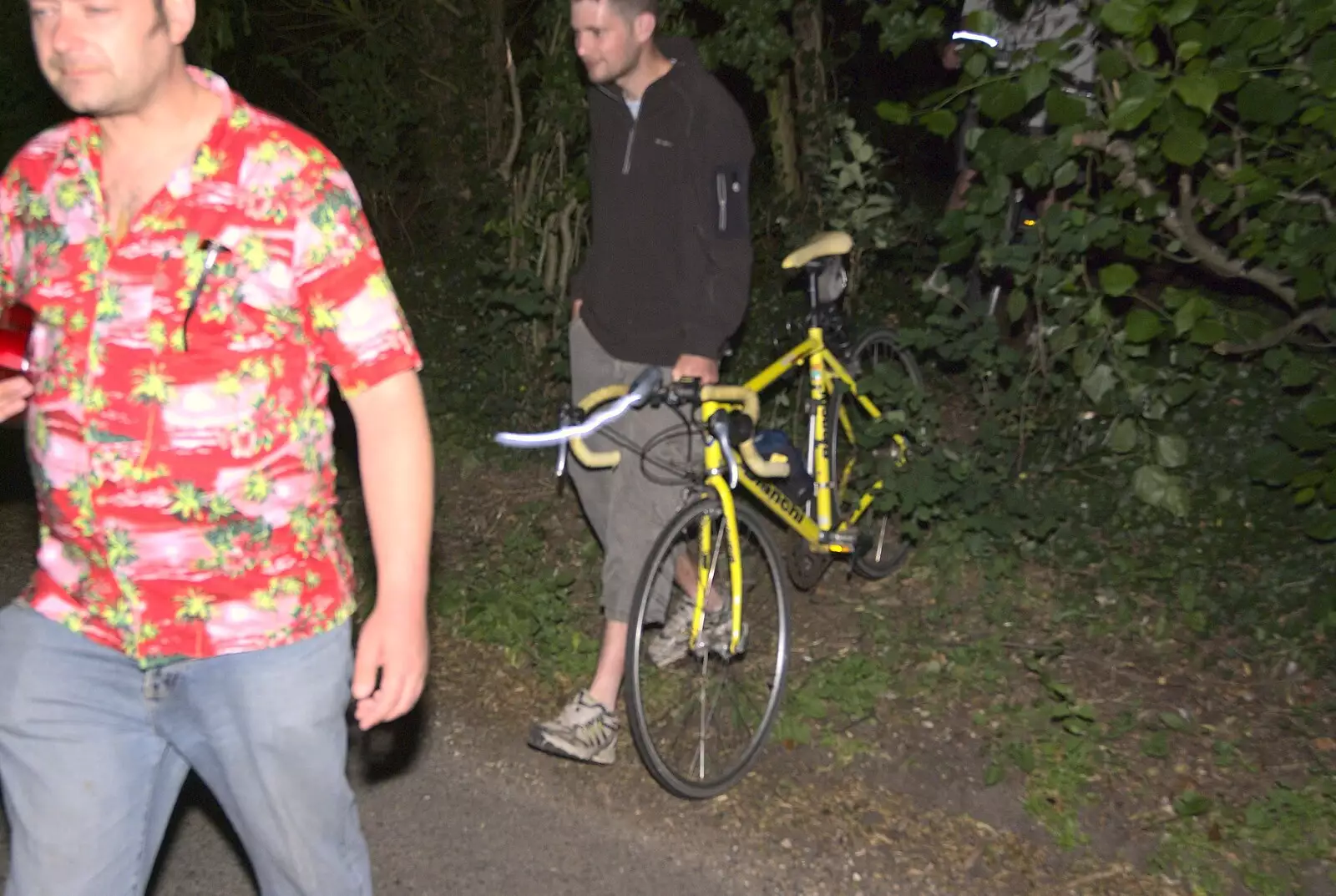 Phil drags his bike through the hedge, from Wedding-Eve Beers at The Swan Inn, Brome, Suffolk - 2nd July 2010