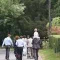 Guests walk down to the church, Nosher and Isobel's Wedding, Brome, Suffolk - 3rd July 2010