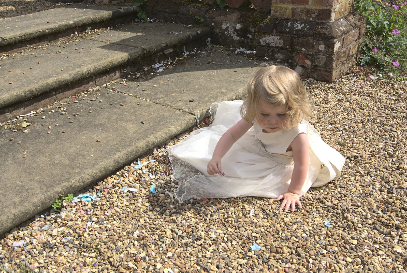 Amelia pokes around in the gravel from Nosher and Isobel's Wedding, Brome, Suffolk - 3rd July 2010