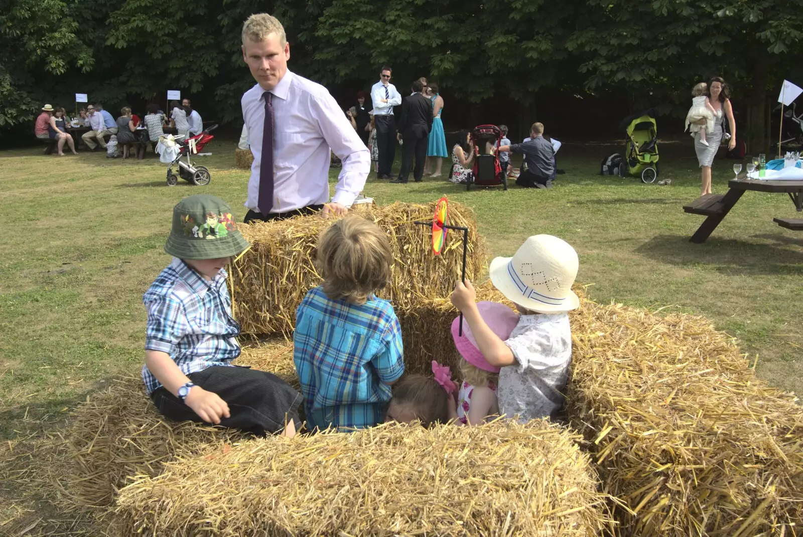 Bill helps build a straw-bale fort, from Nosher and Isobel's Wedding, Brome, Suffolk - 3rd July 2010