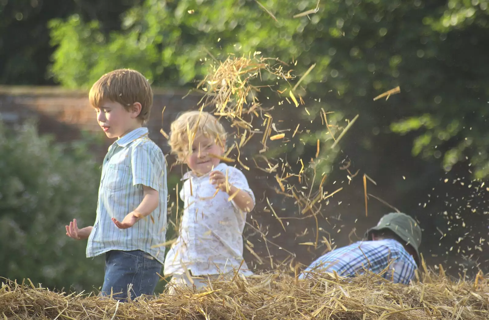 More straw flies around, from Nosher and Isobel's Wedding, Brome, Suffolk - 3rd July 2010