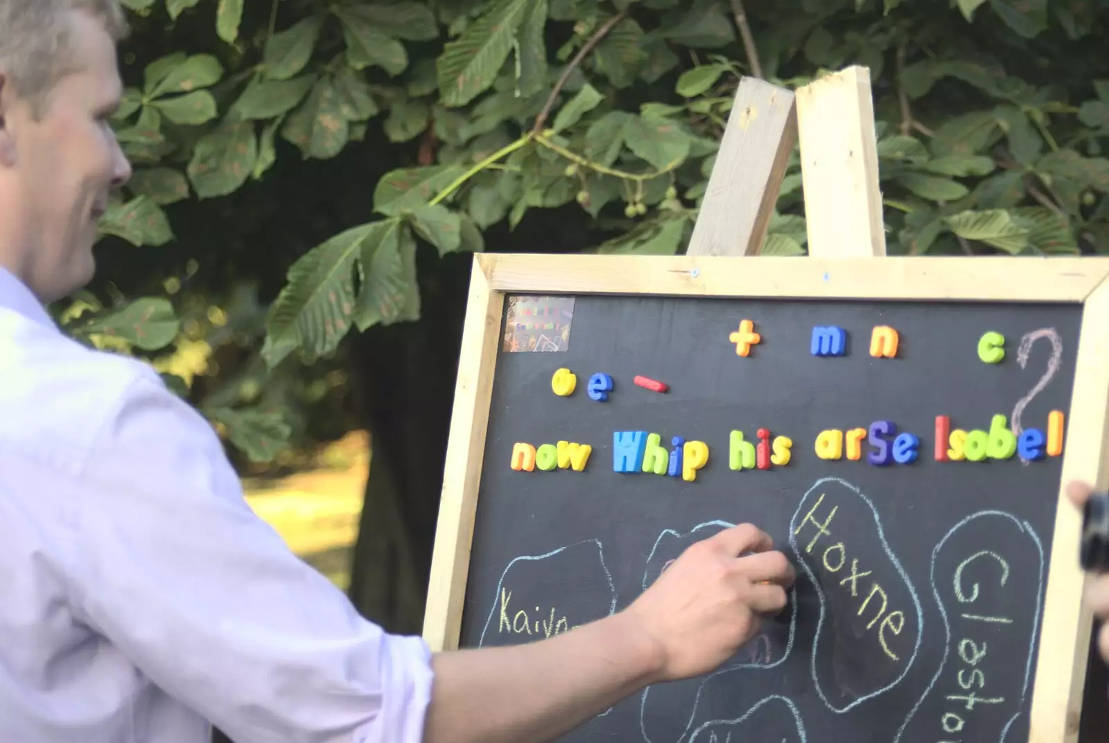 Bill rearranges the magnetic letters, from Nosher and Isobel's Wedding, Brome, Suffolk - 3rd July 2010