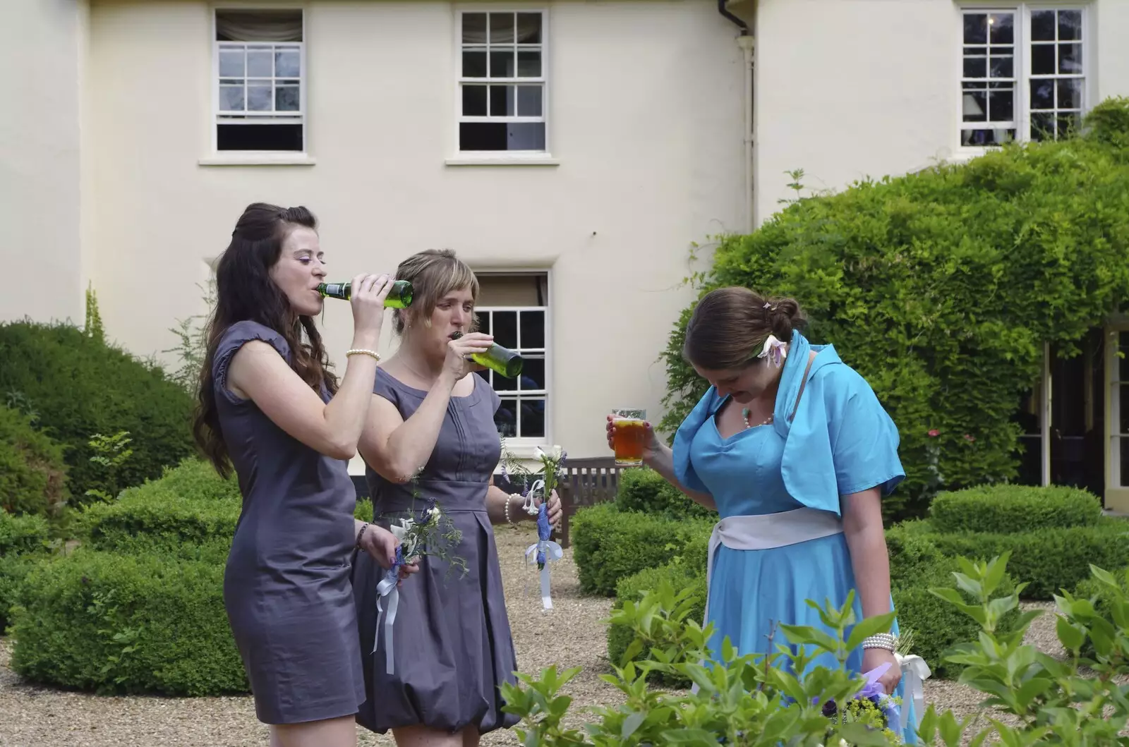 The bridesmaids have a slug of beer, from Nosher and Isobel's Wedding, Brome, Suffolk - 3rd July 2010