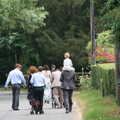 Guests walk down to the church, Nosher and Isobel's Wedding, Brome, Suffolk - 3rd July 2010