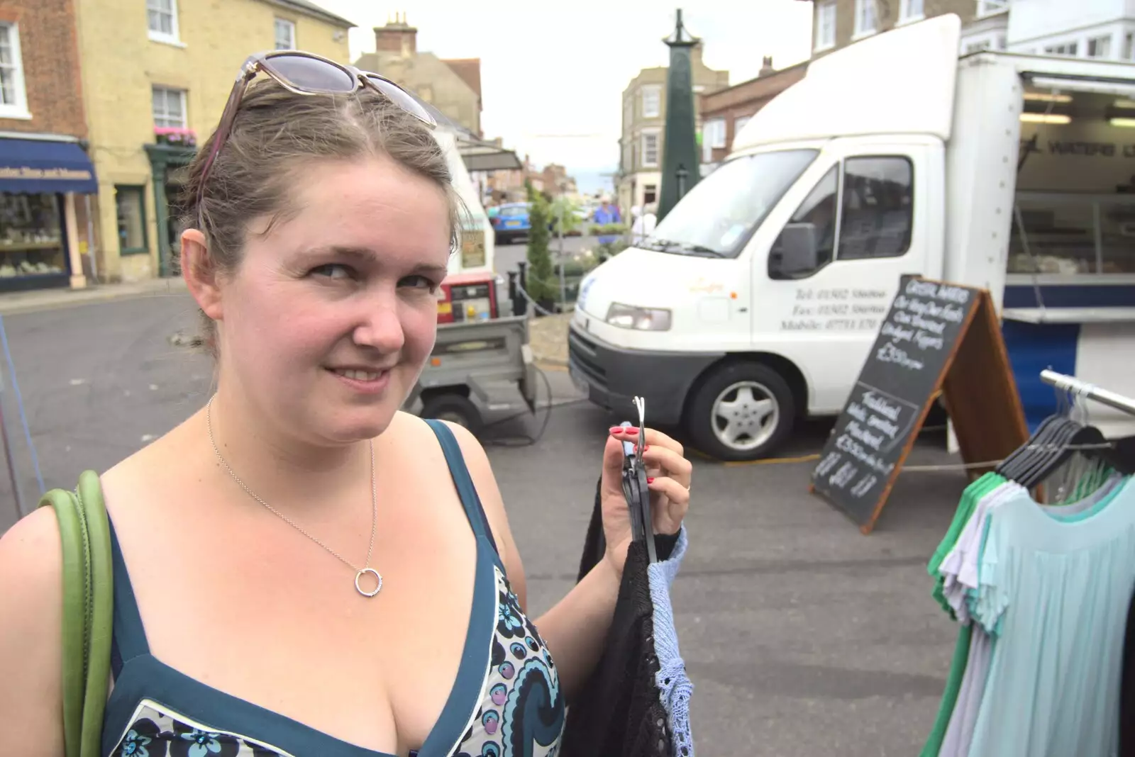 Isobel picks a couple of mini-shoulder-shawls, from A "Minimoon" and an Adnams Brewery Trip, Southwold, Suffolk - 7th July 2010