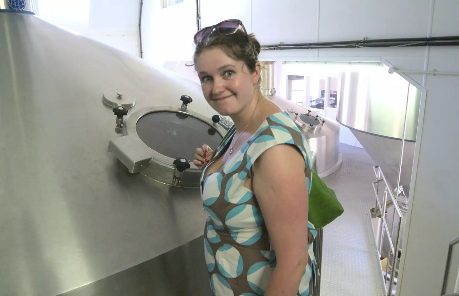 Isobel looks into tanks, from A "Minimoon" and an Adnams Brewery Trip, Southwold, Suffolk - 7th July 2010