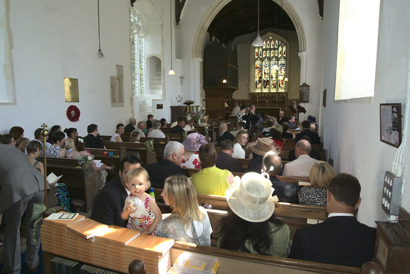 The crowd is ready in the church from Clive and Suzanne's Wedding, Oakley and Brome, Suffolk - 10th July 2010