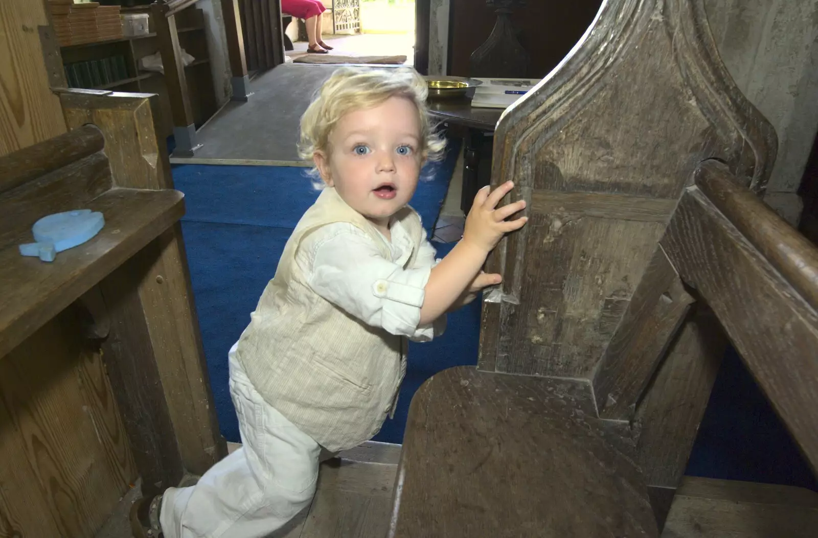 Fred climbs around on the pews, from Clive and Suzanne's Wedding, Oakley and Brome, Suffolk - 10th July 2010