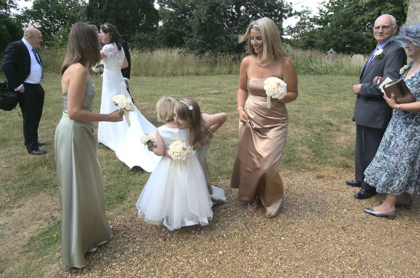 Ellie hugs a small bridesmaid, from Clive and Suzanne's Wedding, Oakley and Brome, Suffolk - 10th July 2010