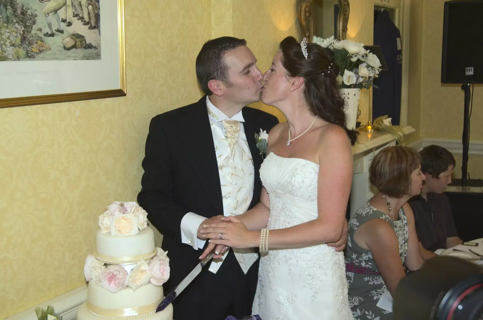 A kiss at the cake cutting, from Clive and Suzanne's Wedding, Oakley and Brome, Suffolk - 10th July 2010