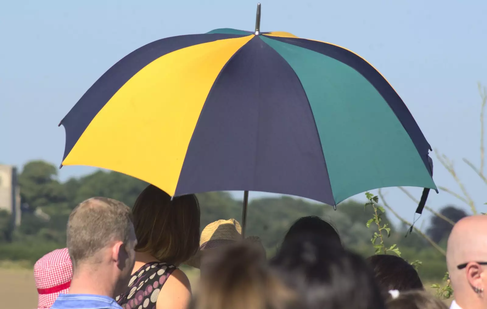 An umbrella provides some relief from the sun, from Clive and Suzanne's Wedding, Oakley and Brome, Suffolk - 10th July 2010