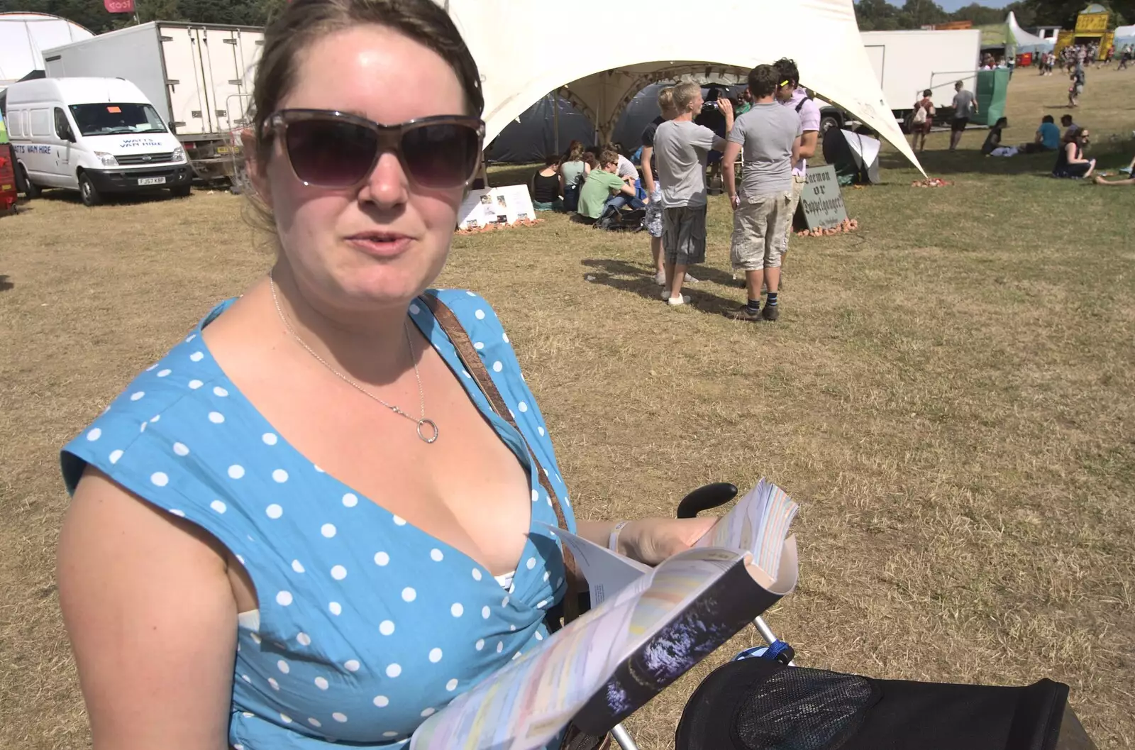 Isobel's got a guide book, from The Fifth Latitude Festival, Henham Park, Suffolk - 16th July 2010