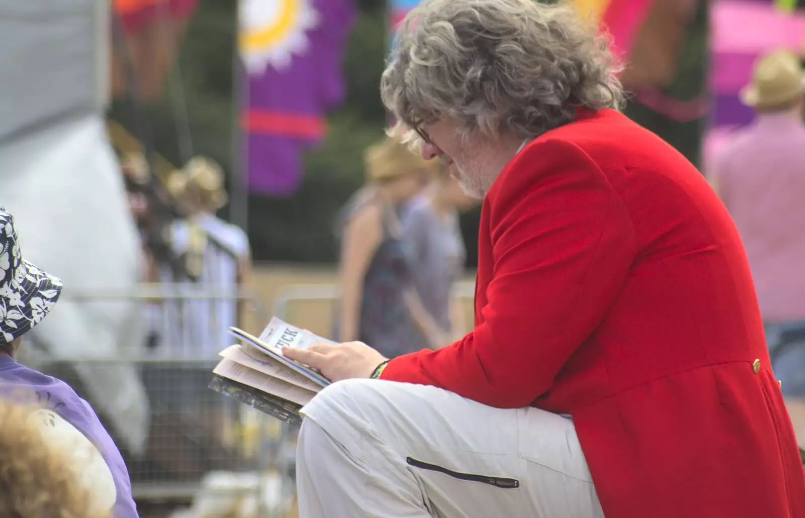 The huntsman reads the festival guide, from The Fifth Latitude Festival, Henham Park, Suffolk - 16th July 2010