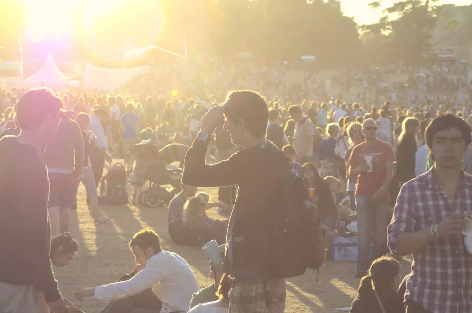 Contra jour: the crowds bask in the evening sunshine, from The Fifth Latitude Festival, Henham Park, Suffolk - 16th July 2010