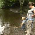 Fred pokes a stick in the river, A Walk in Devil's Glen, County Wicklow, Ireland - 31st July 2010