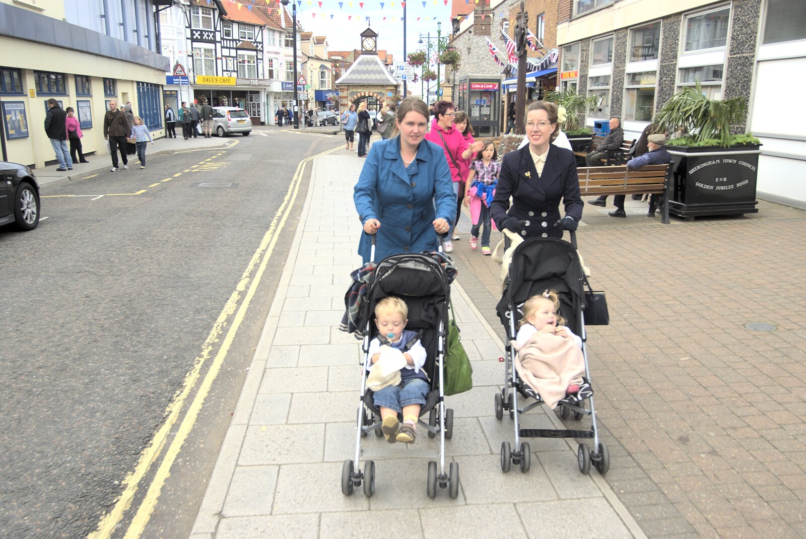 Isobel and Suzanne push babies up the High Street from A 1940s Steam Weekend, Holt and Sheringham, Norfolk - 18th September 2010