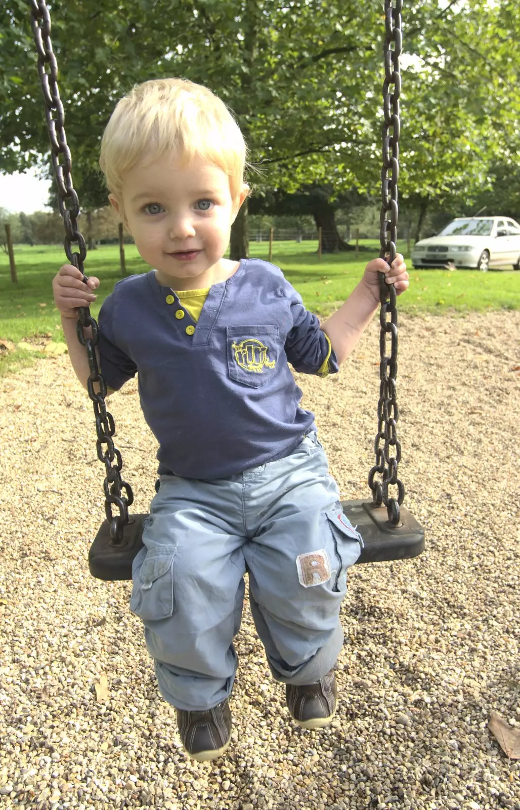 Fred on the swings, from Helicopters on the A14, and a Walk at Thornham, Suffolk - 7th October 2010