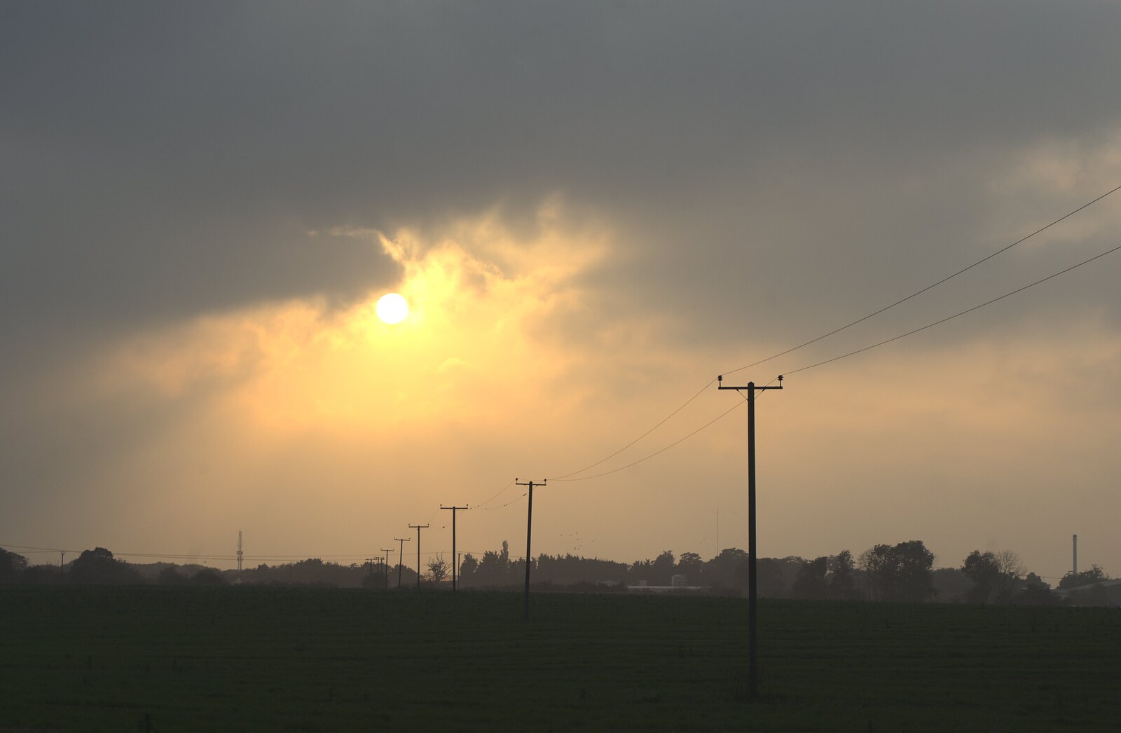 A hazy sun hangs low in the sky from Helicopters on the A14, and a Walk at Thornham, Suffolk - 7th October 2010