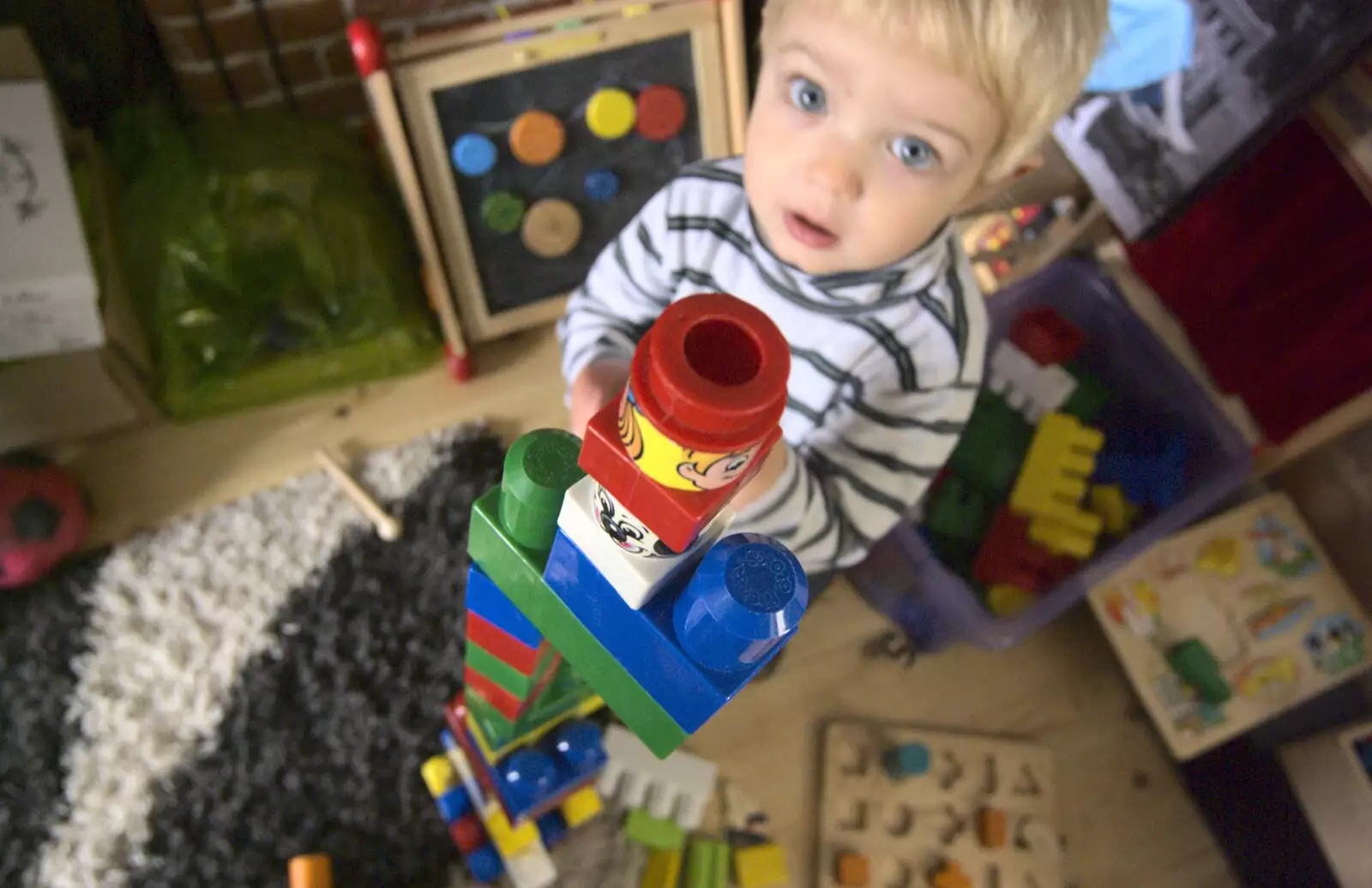 Fred builds a tower out of Mega Blocks, from Norwich By Train, Norfolk - 16th October 2010