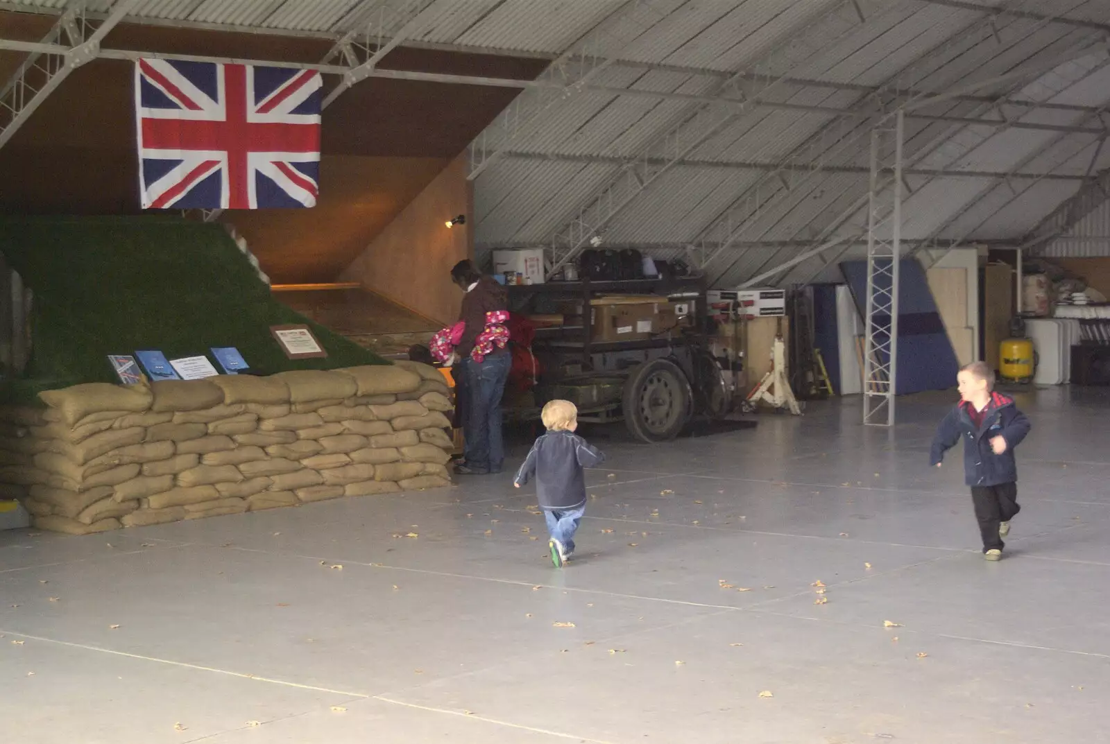 Fred runs around in the hangar, from Maurice Mustang's Open Day, Hardwick Airfield, Norfolk - 17th October 2010