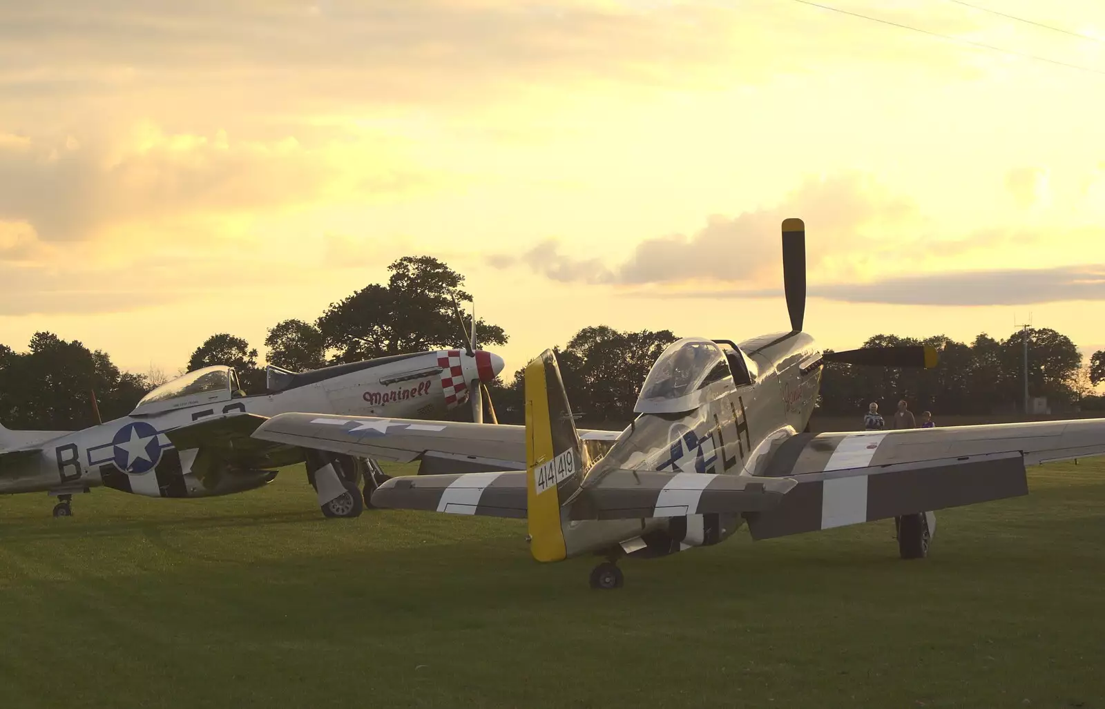 Marinell and Janie watch the setting sun, from Maurice Mustang's Open Day, Hardwick Airfield, Norfolk - 17th October 2010