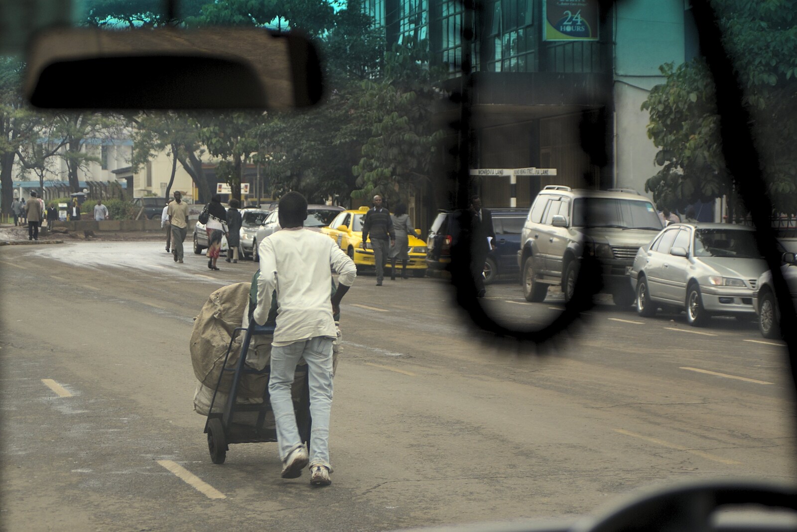 Pushing sack barrows on the street from Nairobi and the Road to Maasai Mara, Kenya, Africa - 1st November 2010