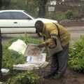 Some dude picks a newspaper up, Nairobi and the Road to Maasai Mara, Kenya, Africa - 1st November 2010