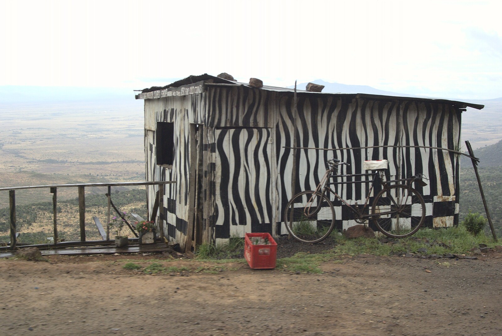 A zebra-striped hut looks out over the Rift Valley from Nairobi and the Road to Maasai Mara, Kenya, Africa - 1st November 2010