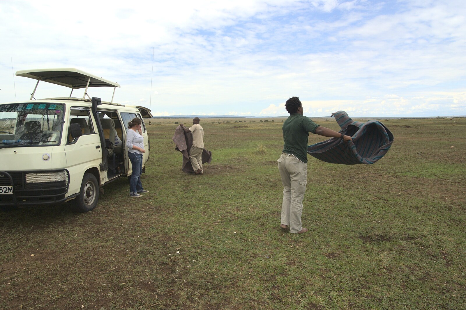 Picnic over, Will shakes out the blanket from Maasai Mara Safari and a Maasai Village, Ololaimutia, Kenya - 5th November 2010