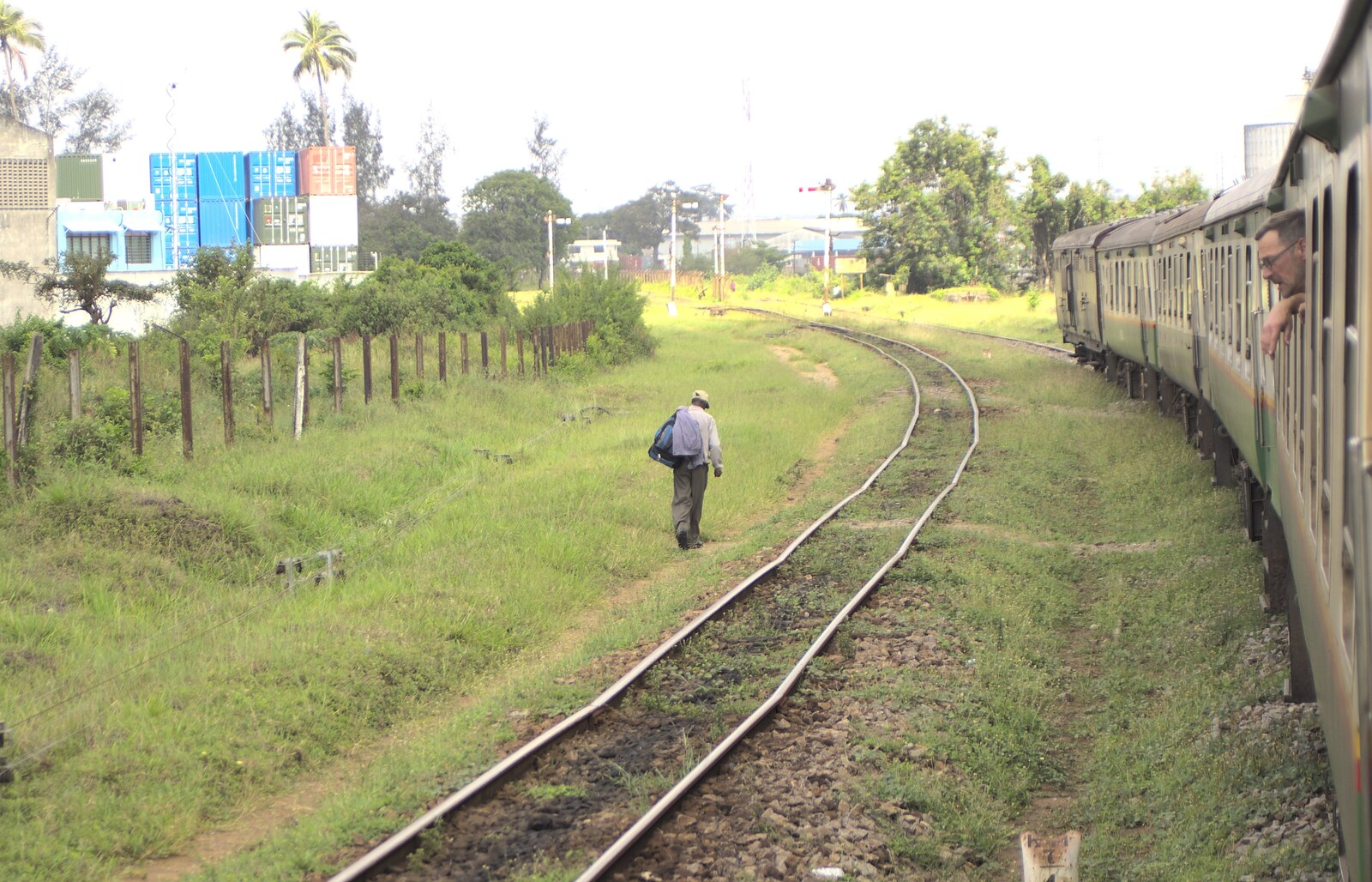 Long Train (not) Runnin': Tiwi Beach, Mombasa, Kenya - 7th November 2010: Some dude walks along the tracks