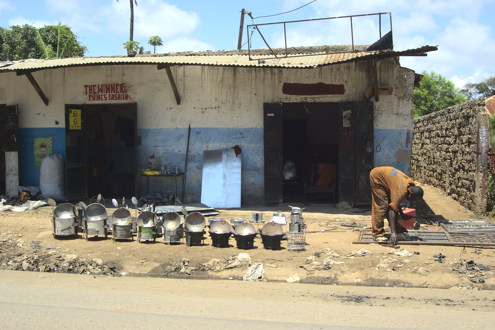Long Train (not) Runnin': Tiwi Beach, Mombasa, Kenya - 7th November 2010: A shop in Likoni sells metal pots
