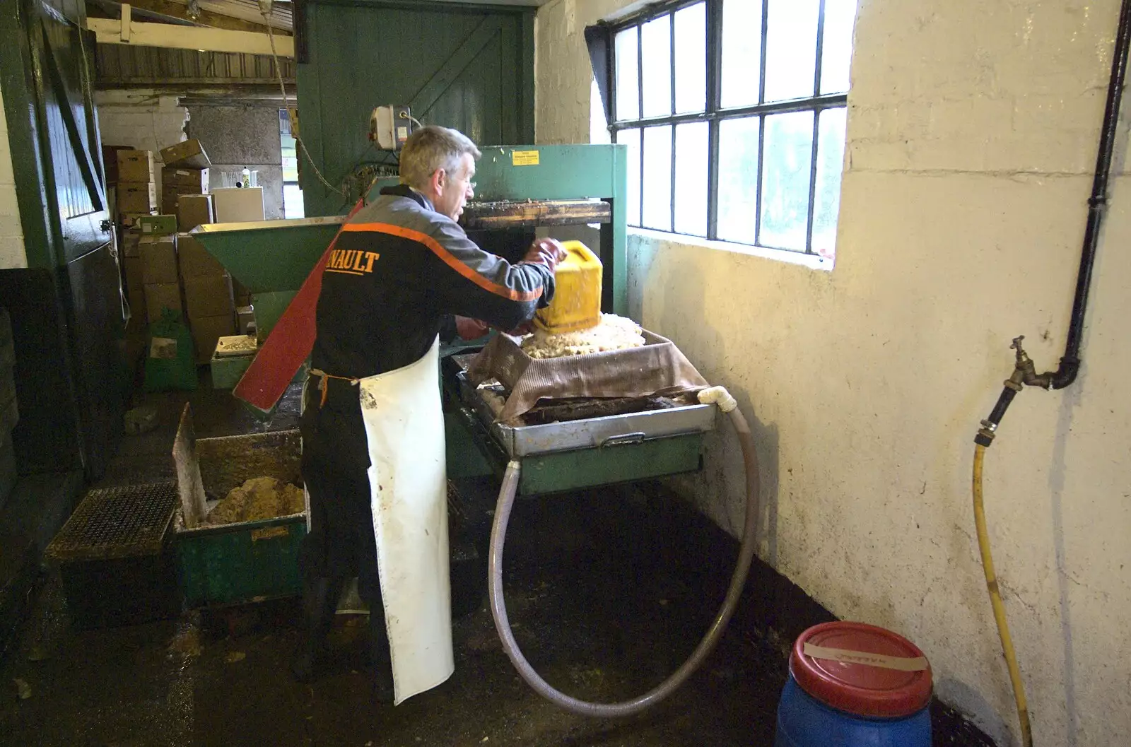 Trevor piles on another blob of pulped apples, from Apple Pressing and Amandine's Jazz, Diss, Norfolk - 21st November 2010