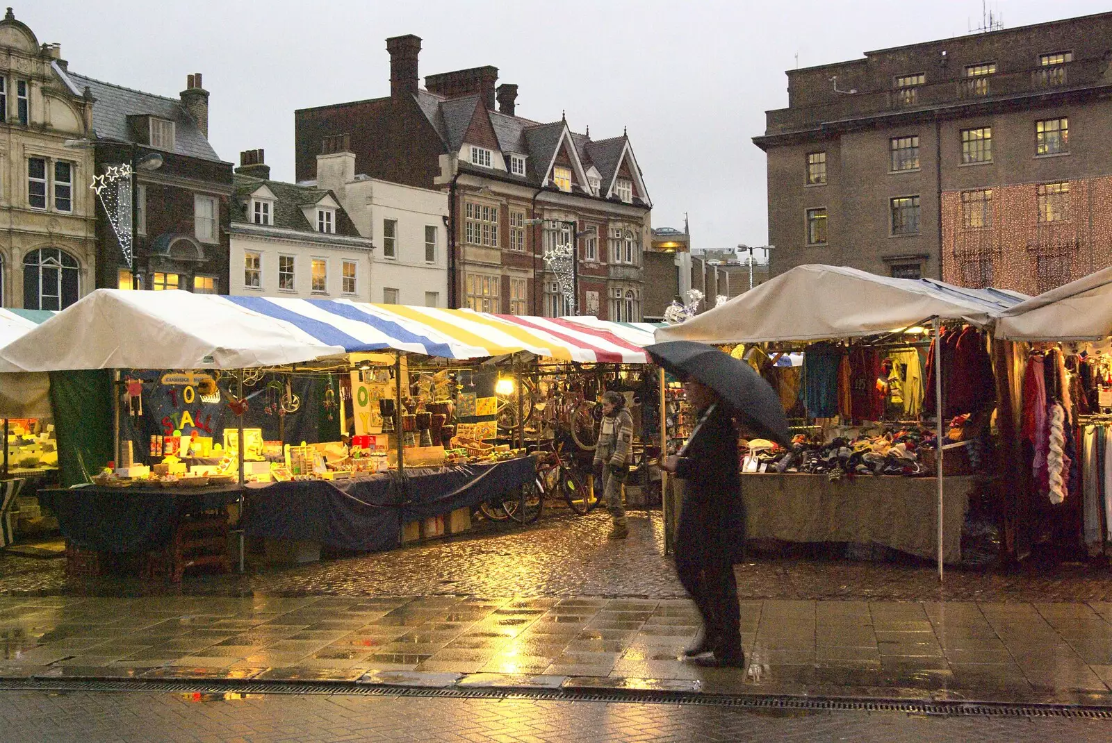 Market stalls are an oasis of light in the gloom, from Qualcomm's Christmas Party and The End of Taptu, Cambridge - 16th December 2010