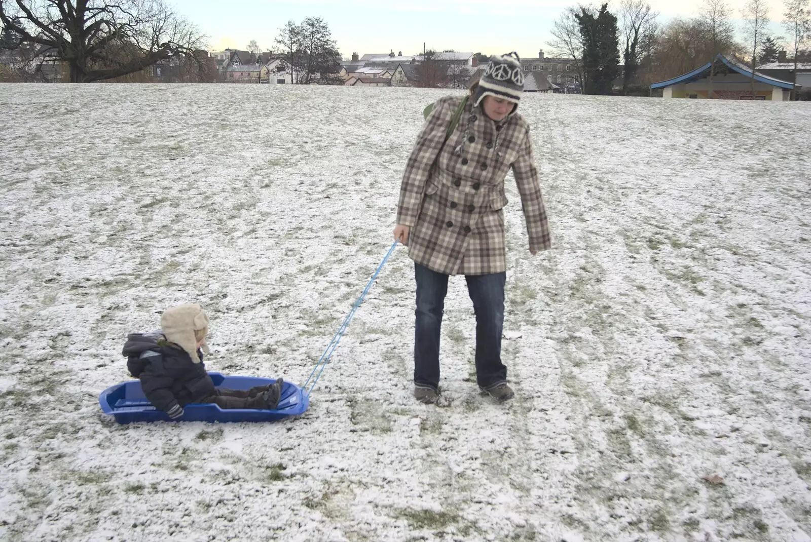 Isobel hauls Fred around on a sledge, from Sledging, A Trip to the Zoo, and Thrandeston Carols, Diss and Banham, Norfolk - 20th December 2010