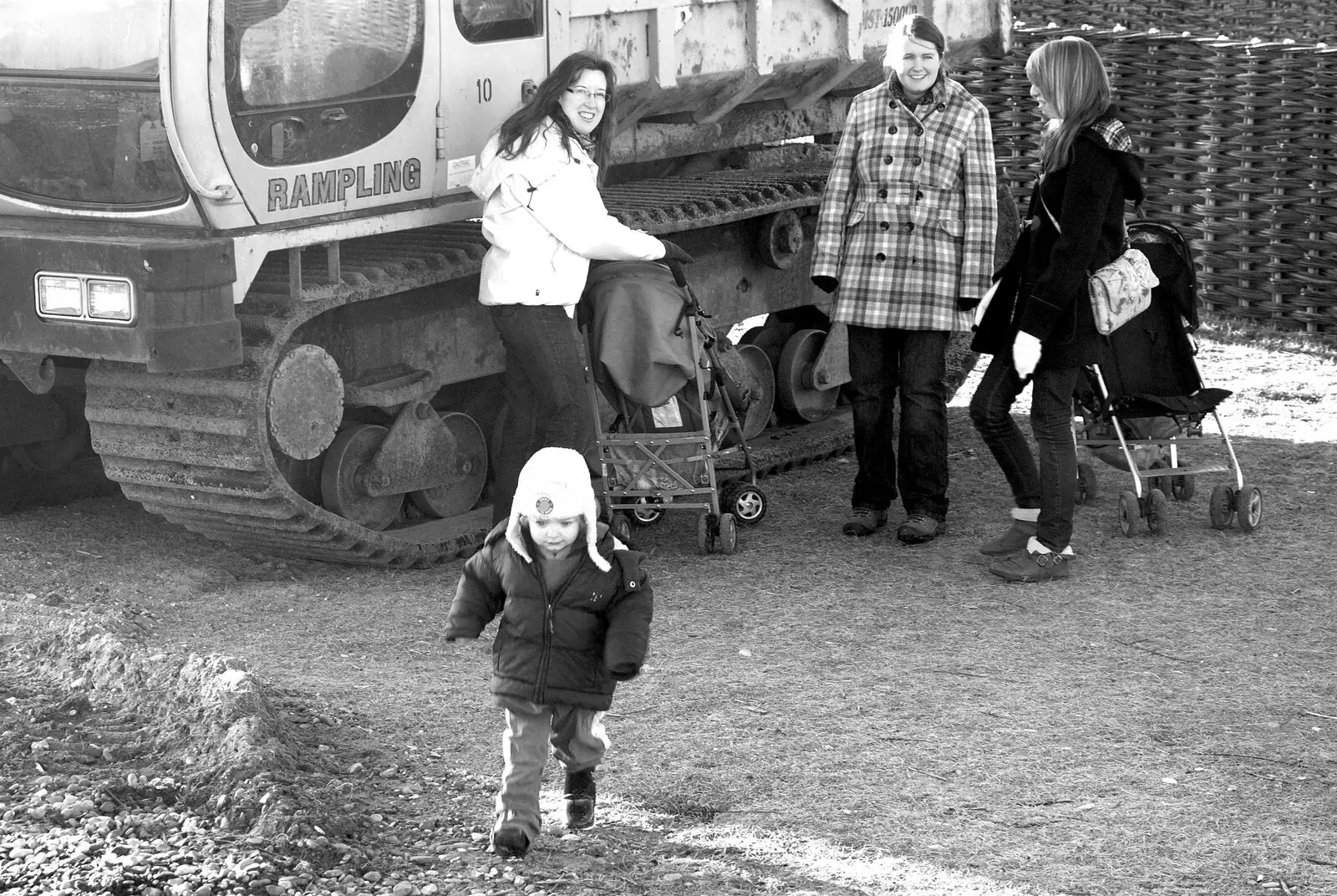 Fred runs around by a digger, from A Trip to Thorpeness, Suffolk - 9th January 2011