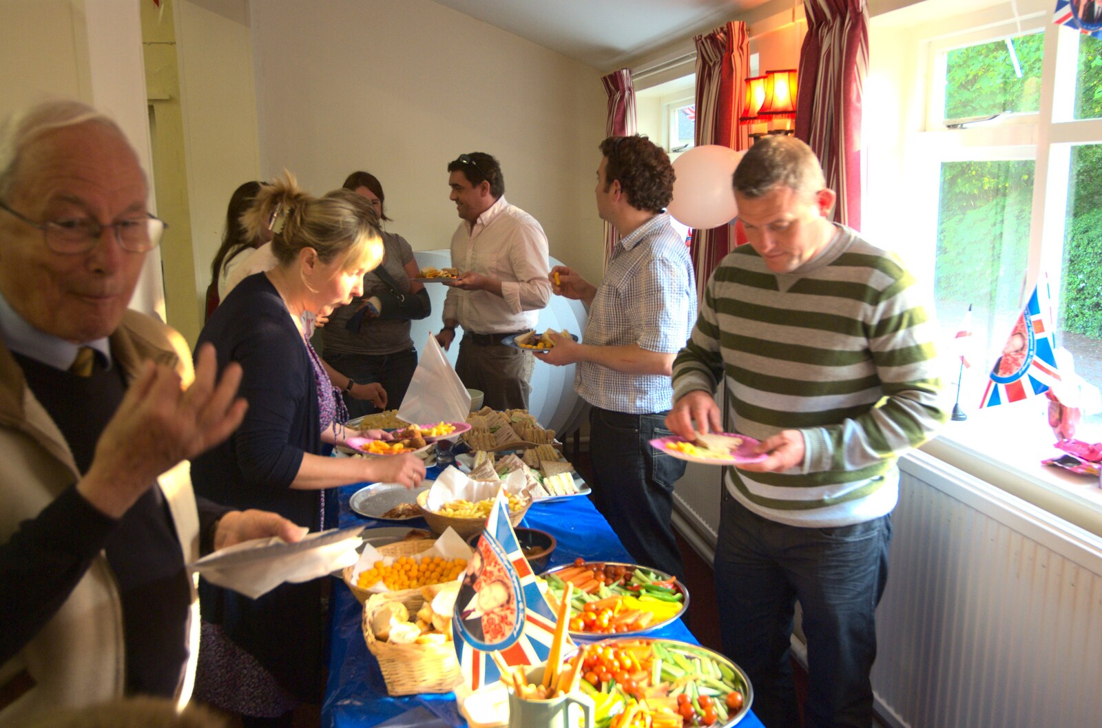Charles gets some party food from Charles and the Royal Wedding, Brome, Suffolk - 24th April 2011