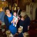 Jemma holds up a newly-annointed Thomas, A Christening, Wilford, Northamptonshire - 22nd May 2011