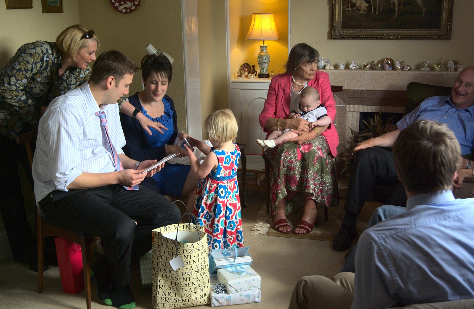 Elizabeth helps to open the presents from A Christening, Wilford, Northamptonshire - 22nd May 2011