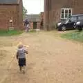 Fred runs about the farmyard, A Christening, Wilford, Northamptonshire - 22nd May 2011