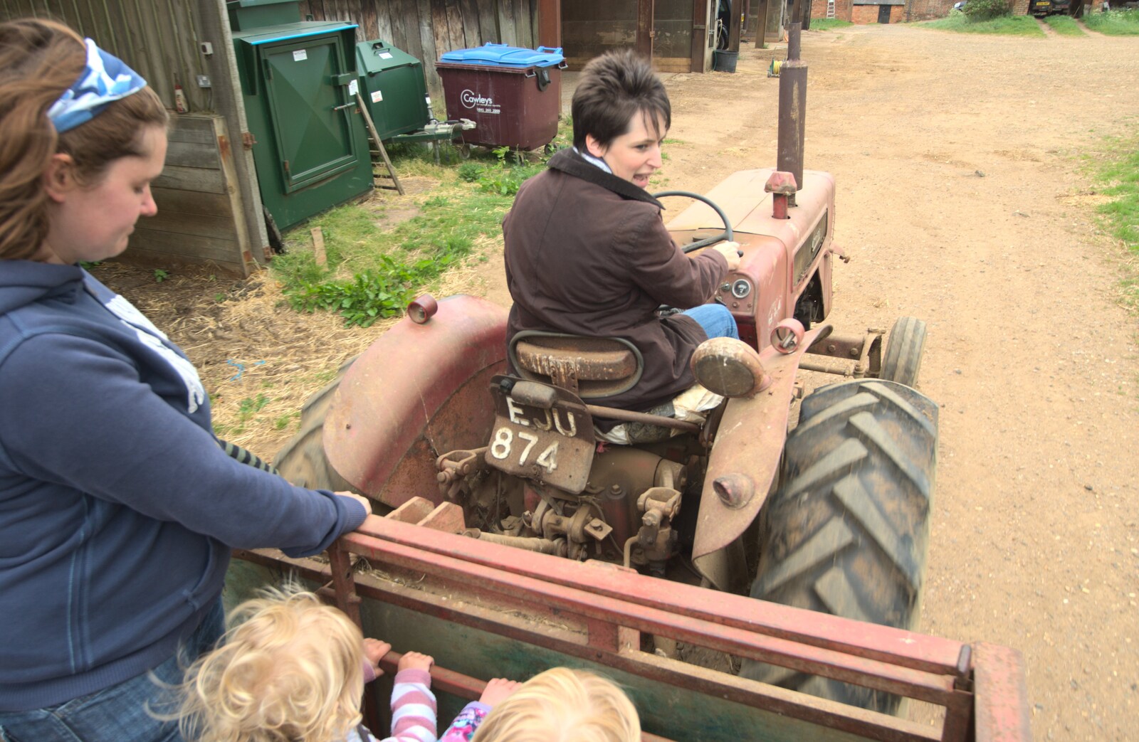 Jemma fires up the old International tractor from A Christening, Wilford, Northamptonshire - 22nd May 2011
