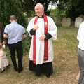 The reverend Thompson outside the church, A Christening at St. Mary's Church, Wortham, Suffolk - 12th June 2011