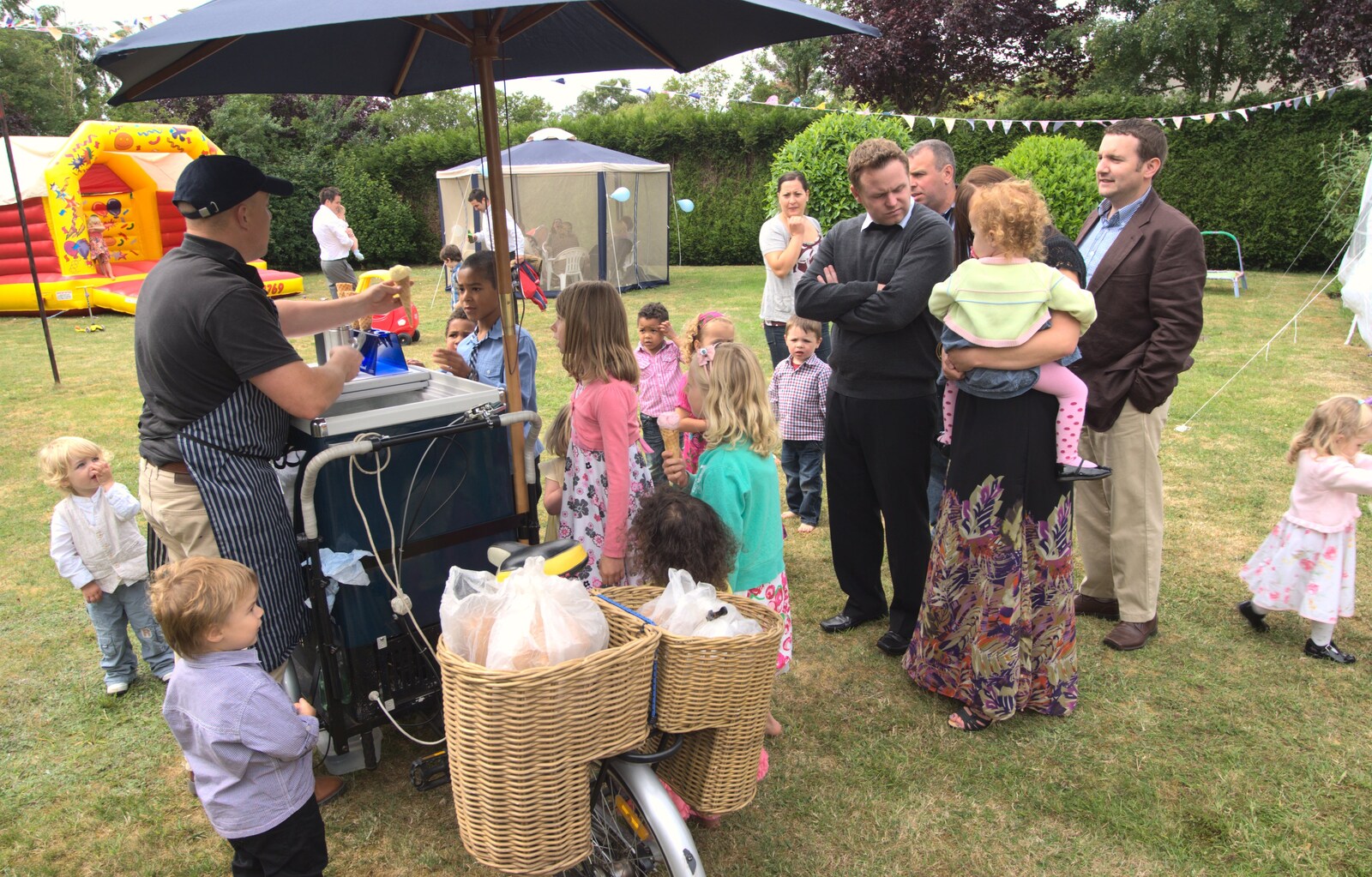 The ice-cream man turns up from A Christening at St. Mary's Church, Wortham, Suffolk - 12th June 2011