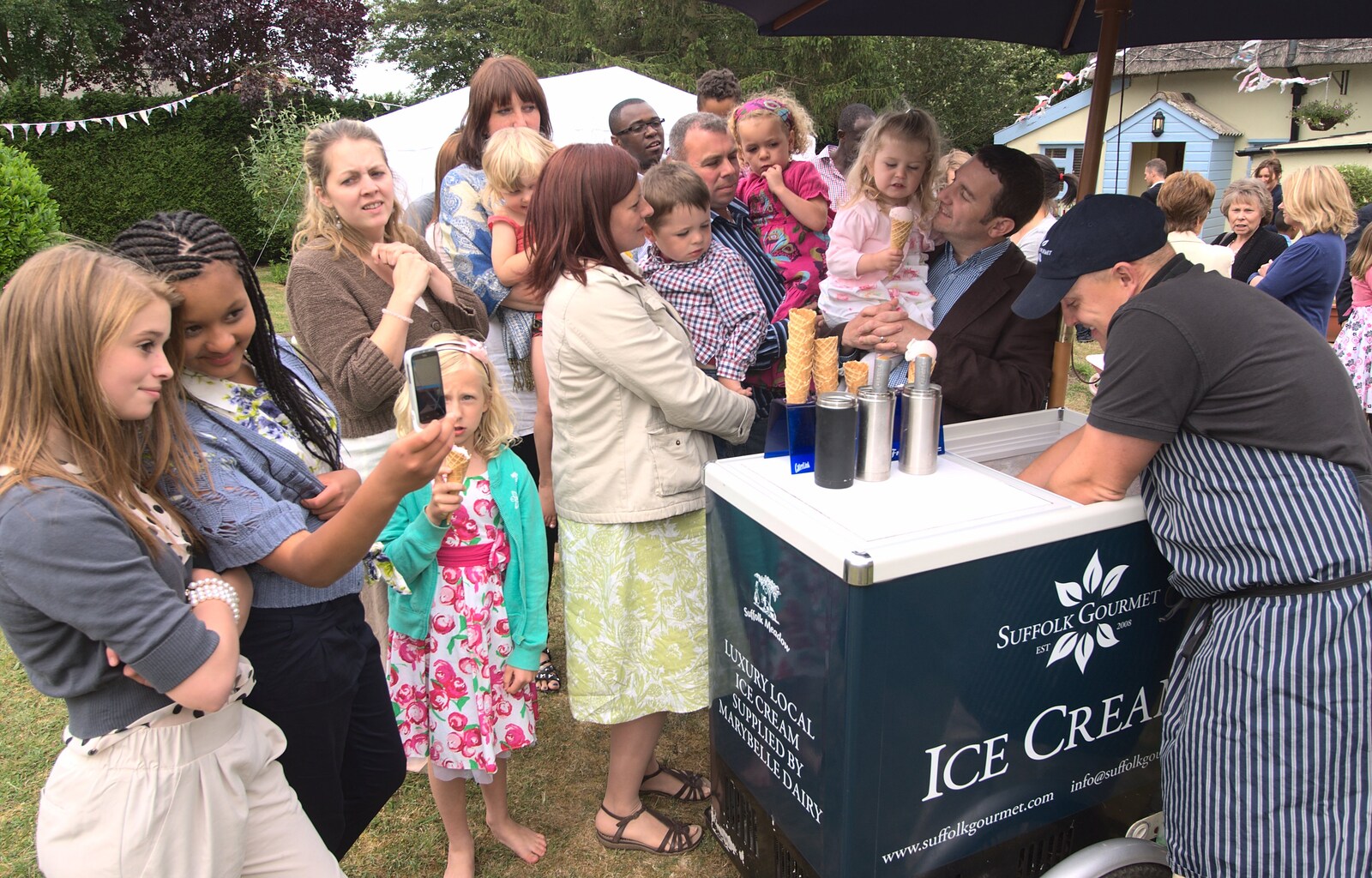 Everyone wants ice cream from A Christening at St. Mary's Church, Wortham, Suffolk - 12th June 2011