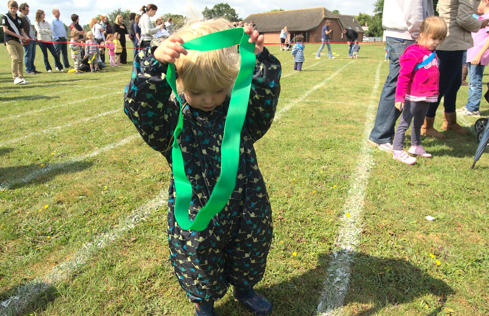 Fred wrangles a green sash from Fred's First Sports Day, Palgrave, Suffolk - 18th June 2011