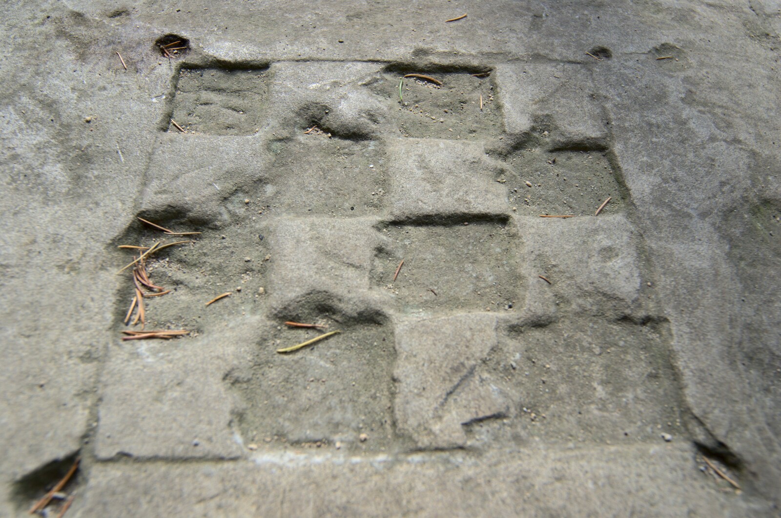 A rudimentary gaming board, carved in to stone from A Camper Van Odyssey: Oxford, Salisbury, New Forest and Barton-on-Sea - 19th June 2011