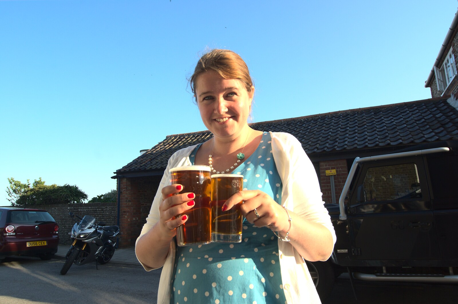 Isobel gets the beers in from The First Anniversary, Southwold, Suffolk - 3rd July 2011