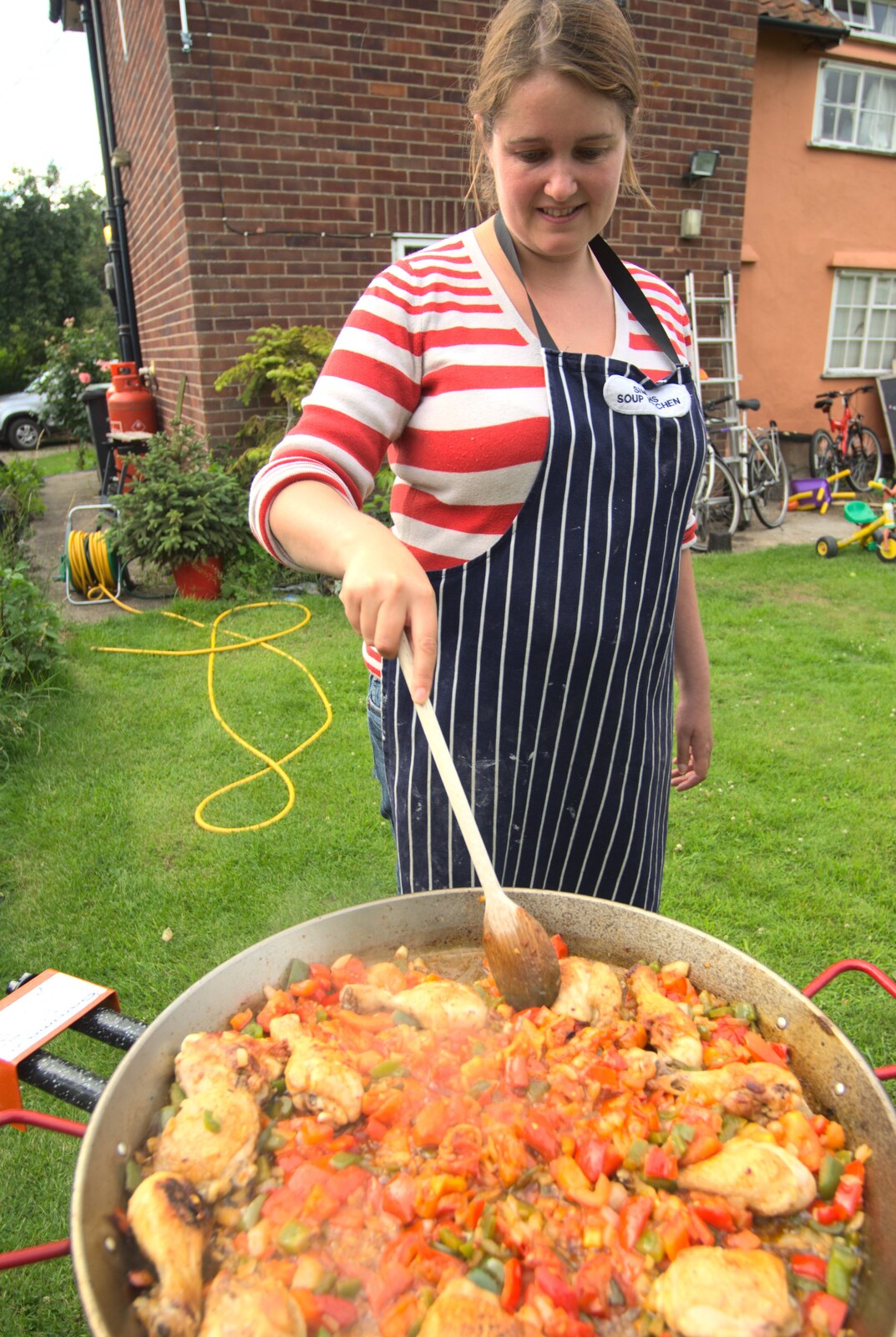 Isobel stirs it up from Paella and Roadworks, Brome, Suffolk - 9th July 2011