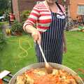 Isobel stirs it up, Paella and Roadworks, Brome, Suffolk - 9th July 2011