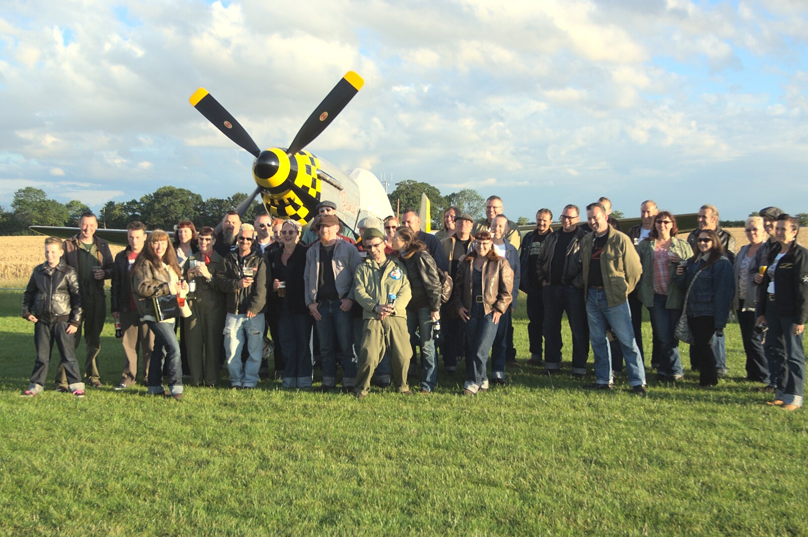 A group of people crowd around Janie for a photo from Maurice's Mustang Hangar Dance, Hardwick Airfield, Norfolk - 16th July 2011